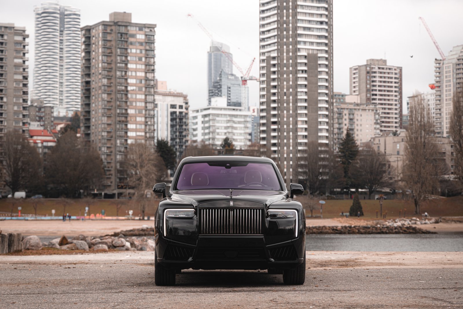 Rolls-Royce Cullinan head-on with the Vancouver skyline behind