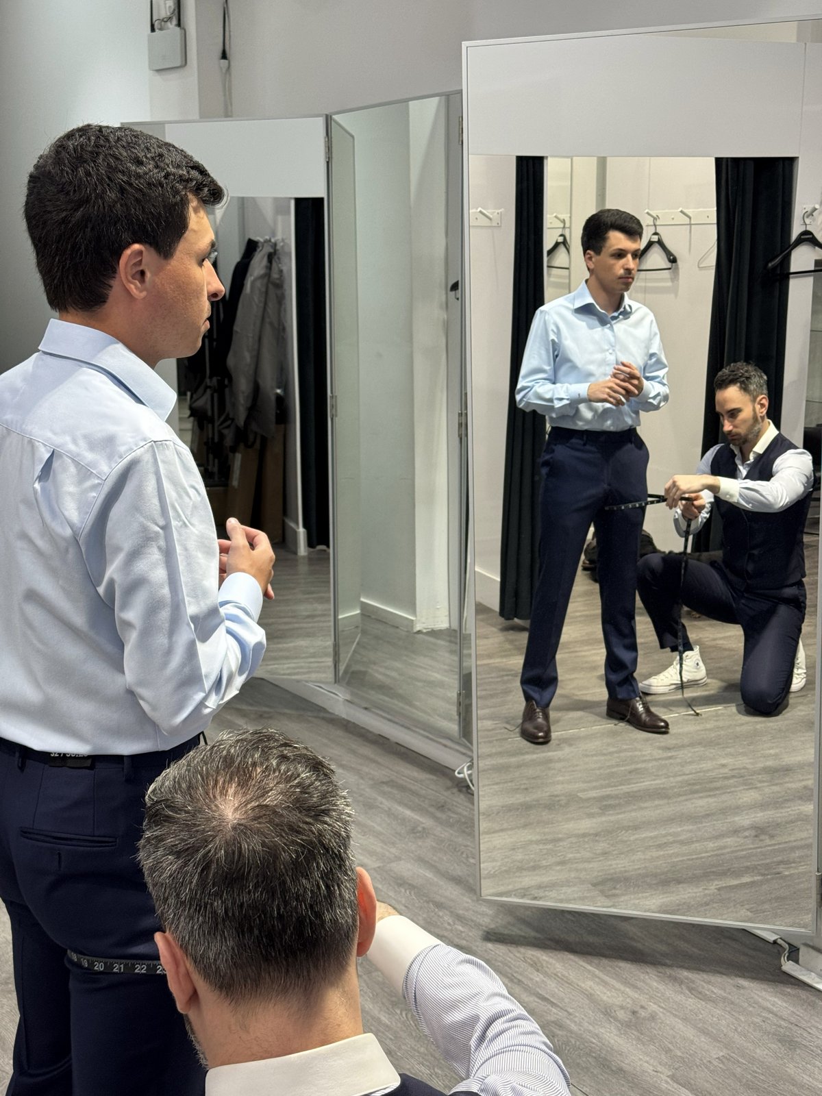 Jason Verners in front of the mirror during his Surmesur fitting in Vancouver